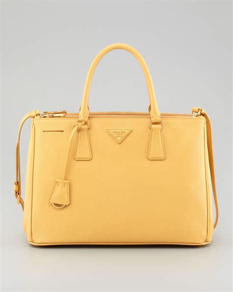 yellow prada bag.